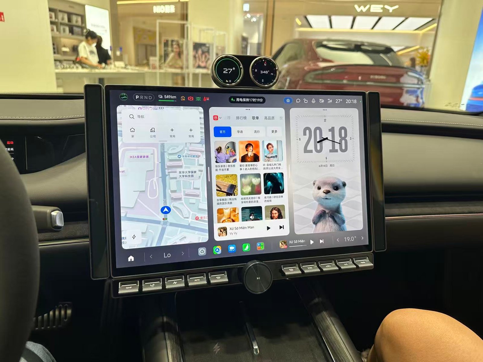 Large EV center display studied by the Autolind team during showroom research.
