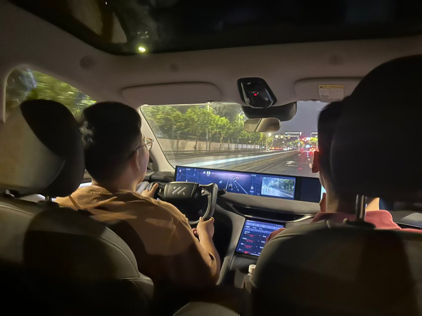 Autolind founding team experiencing an EV dashboard during a test drive.