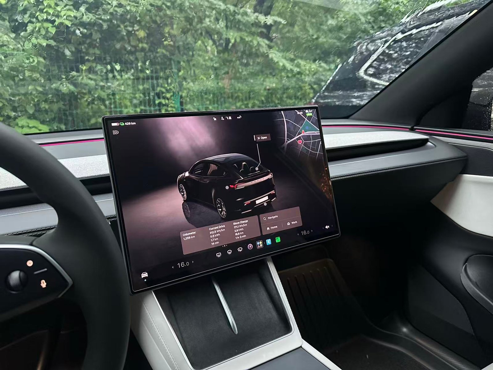 2026 Tesla Model Y screen protector installed on a 16-inch center display, wide cabin view